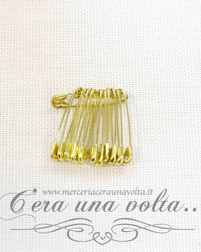 Spille di sicurezza dorate