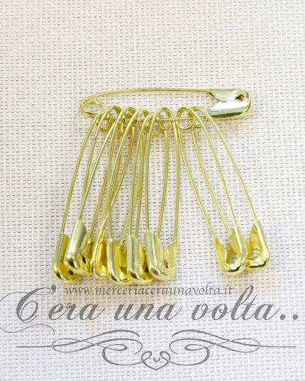 Spille di sicurezza dorate