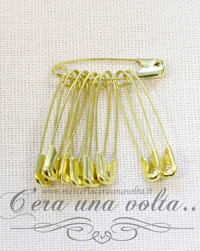 Spille di sicurezza dorate