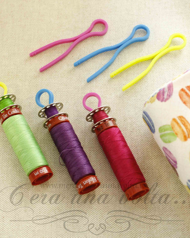 Ganci in plastica portabobine