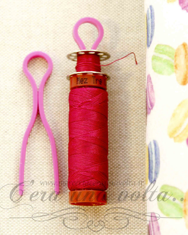 Ganci in plastica portabobine