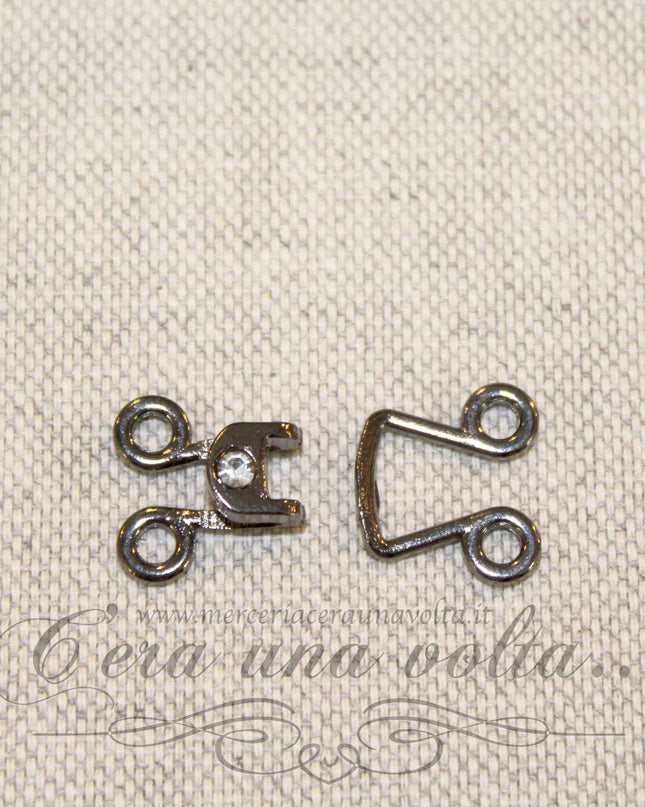 Ganci per abbigliamento con punto luce