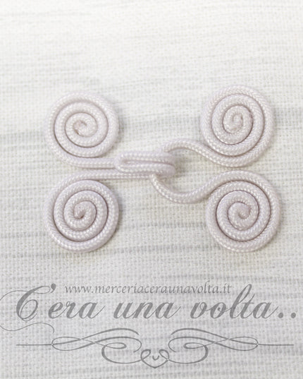 Ganci e occhielli rivestiti avorio