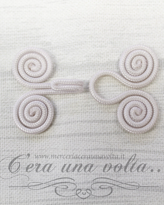 Ganci e occhielli rivestiti avorio