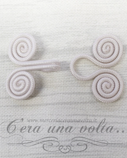 Ganci e occhielli rivestiti avorio
