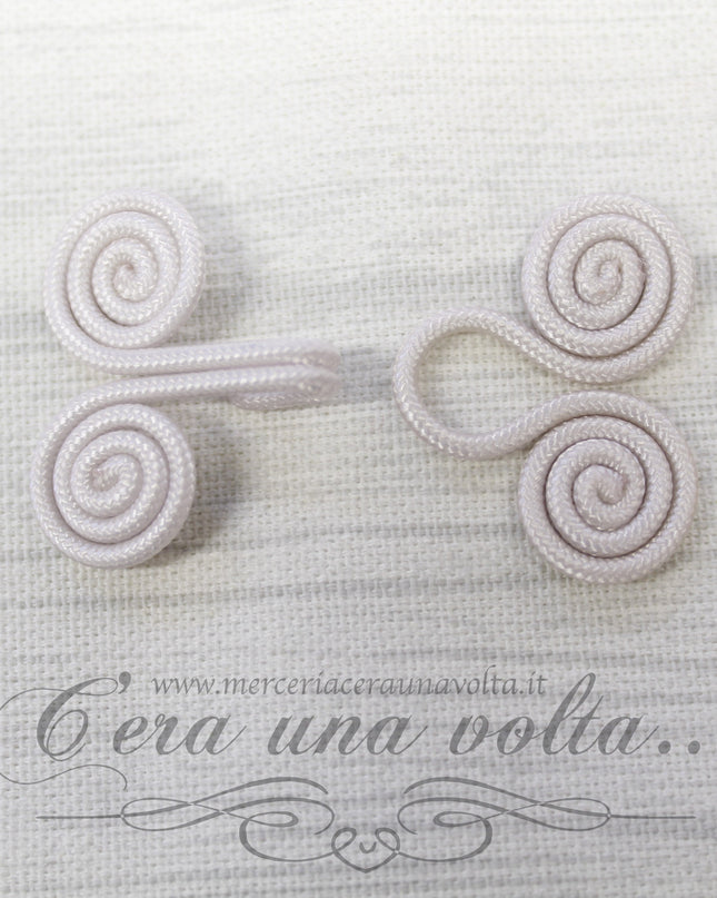 Ganci e occhielli rivestiti avorio