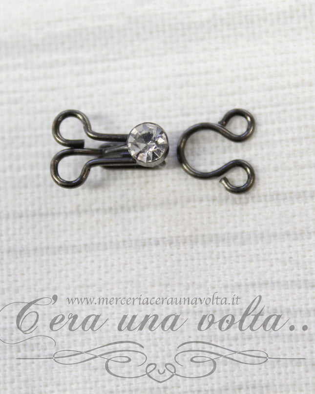 Ganci per abbigliamento con punto luce