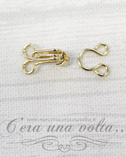Ganci per abbigliamento oro con punto luce