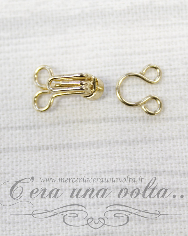 Ganci per abbigliamento oro con punto luce