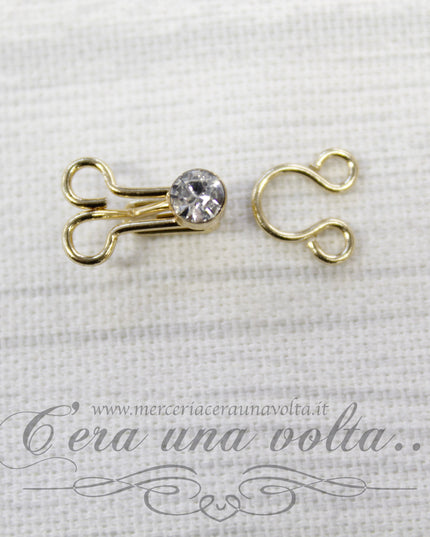 Ganci per abbigliamento oro con punto luce