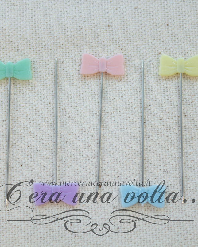Spilli decorati in acciaio fiocco