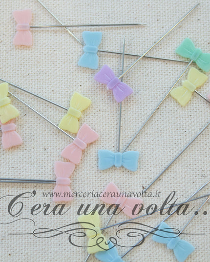 Spilli decorati in acciaio fiocco