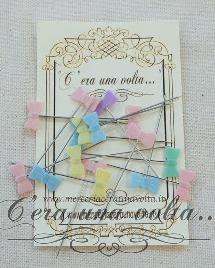 Spilli decorati in acciaio fiocco
